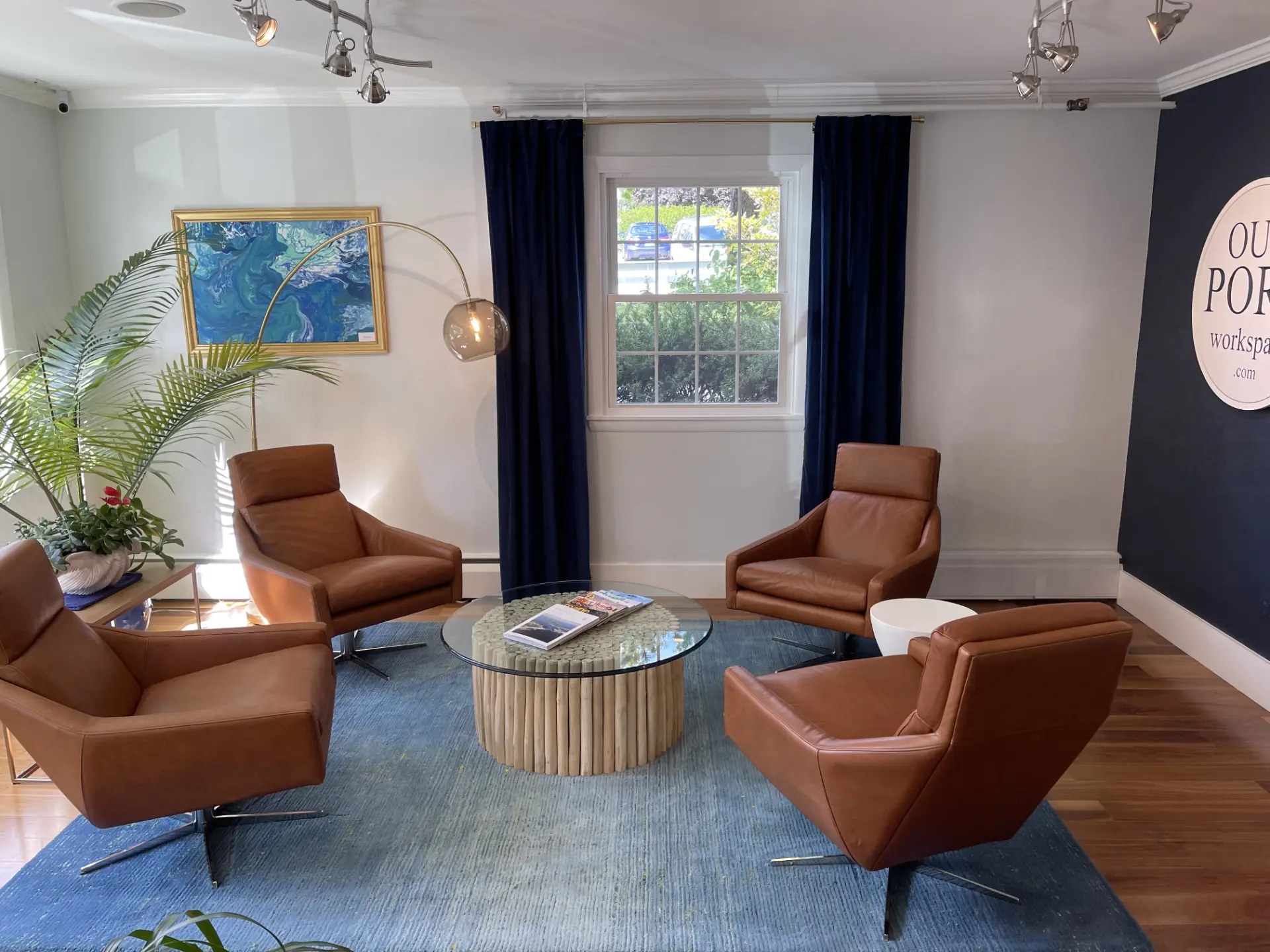 Our Port lounge with leather chairs and the Our Port sign